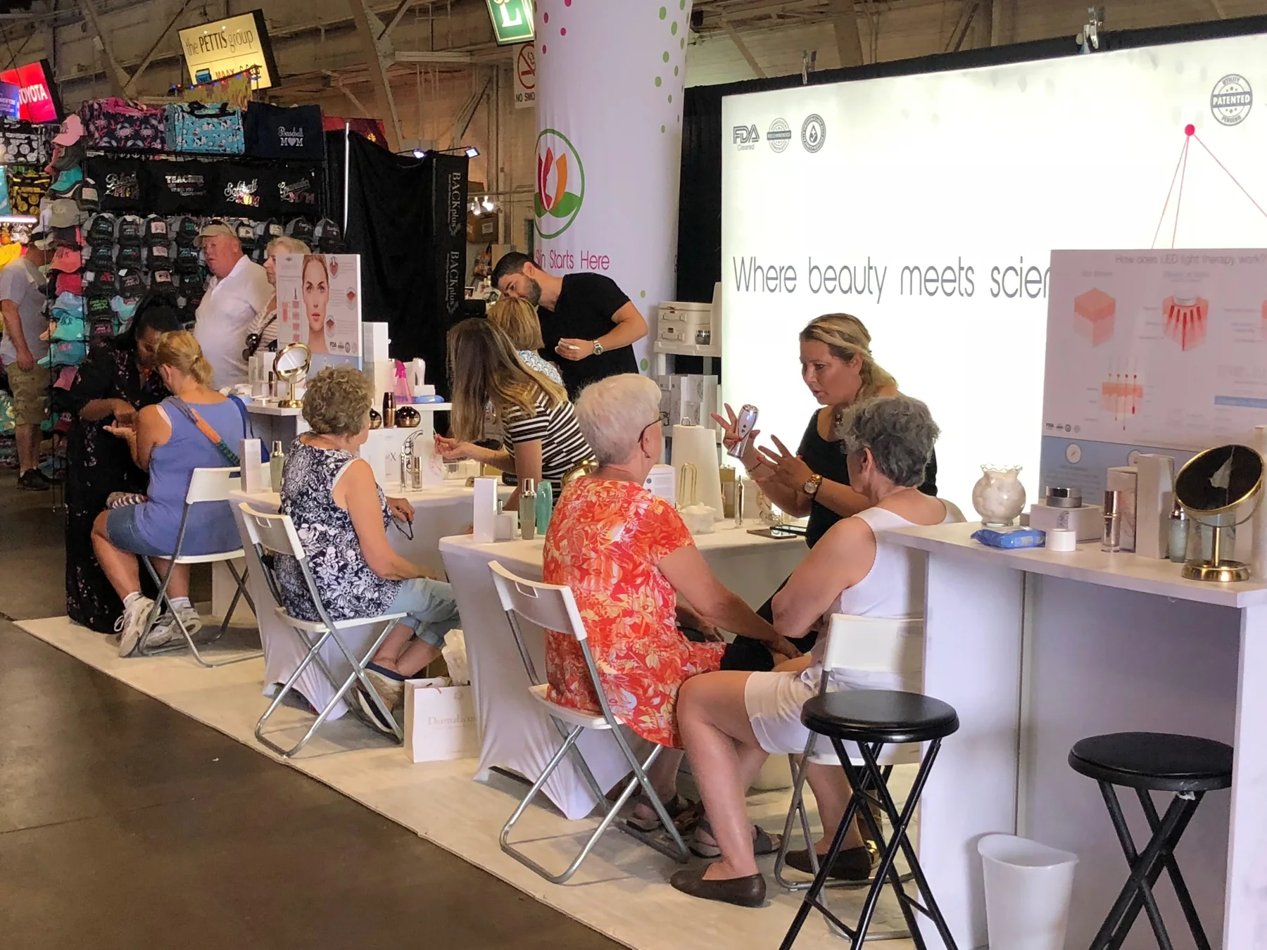 Visitors receiving individual beauty demonstrations