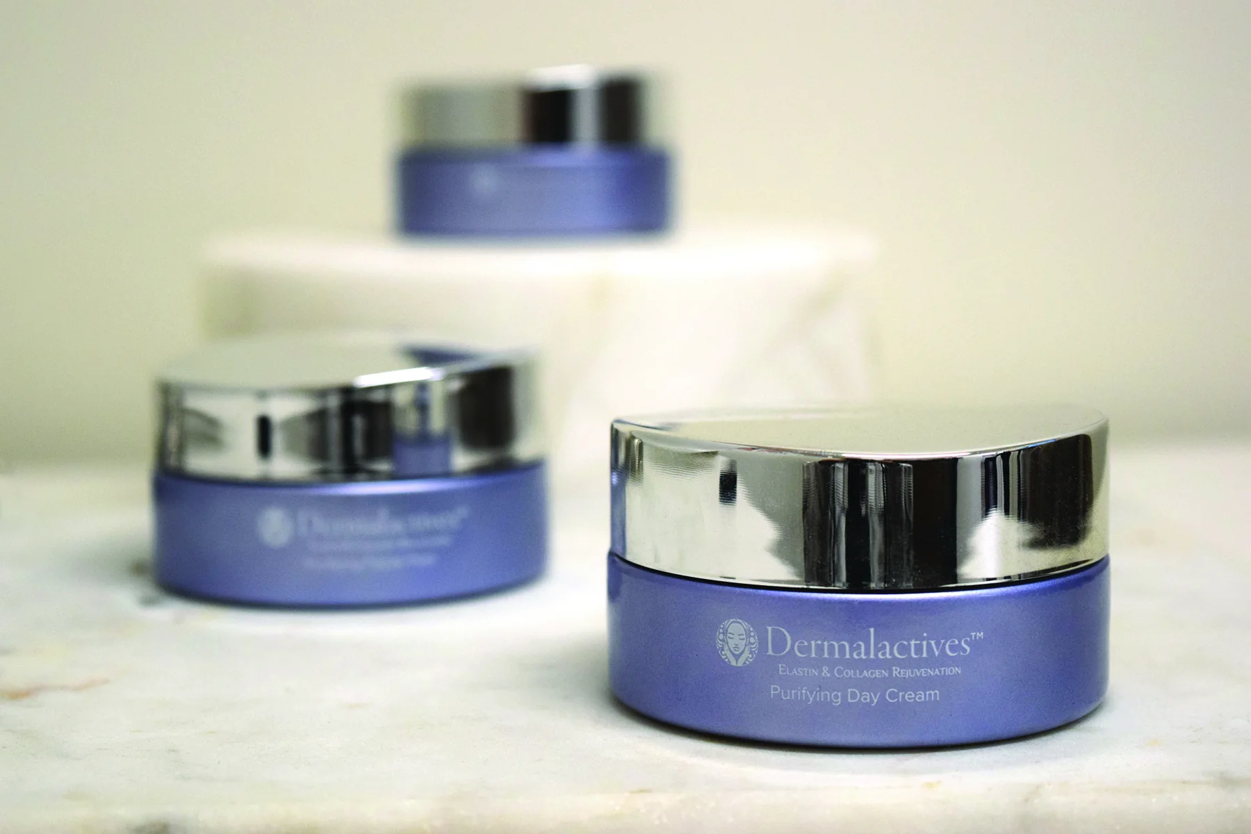Dermalactives skincare jars from the original product photography collection